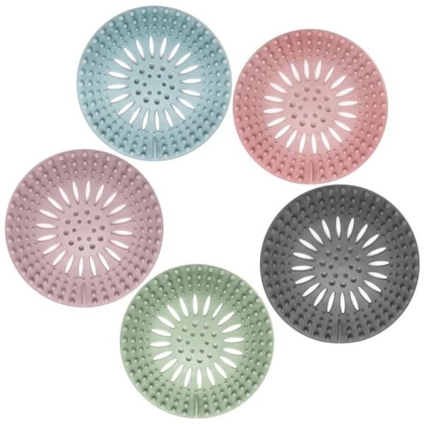 Flexible silicone hair catcher shower drain cover in a bathroom sink preventing hair clogs.