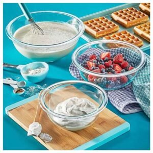 clear bowls being used in the kitchen for mixing ingredients or serving food