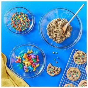 clear bowls being used in the kitchen for mixing ingredients or serving food