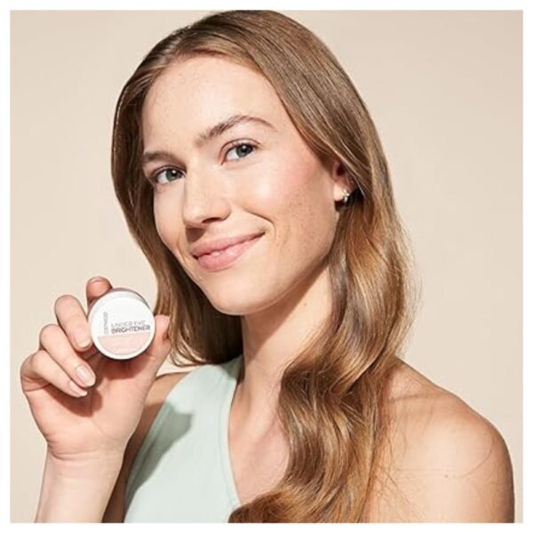 Model using Catrice Under Eye Brightener to brighten and conceal dark circles, showcasing a natural, radiant look