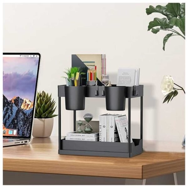 2-tier under sink organizer displayed on a wooden table, featuring sliding drawers, detachable hooks, and hanging cups, used for storing books, decor, and office supplies