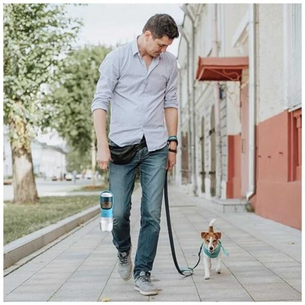 Dog owner using portable water bottle with food container