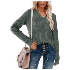 Women wearing a lightweight V-neck long sleeve tunic sweater, holding a stylish bag