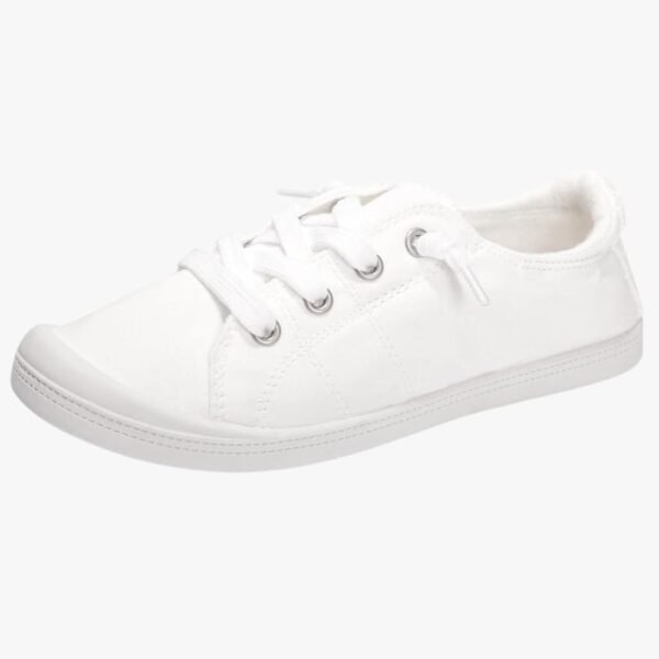 Full view of women's slip-on canvas shoes with a minimalist, classic design, perfect for casual outfits and everyday wear.