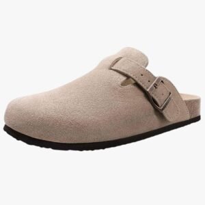 Women's suede leather clogs with adjustable buckle and cork footbed, showcasing the classic design.