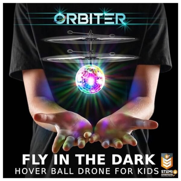 Kids controlling the 1 Pack Orbiter Flying Orb Ball drone indoors with hands.