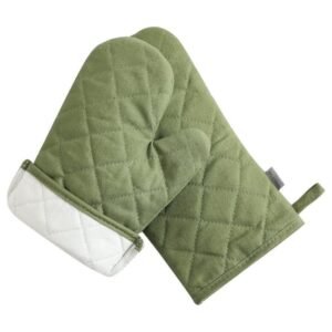 Set of two green oven mitts and two matching pot holders displayed on a countertop.