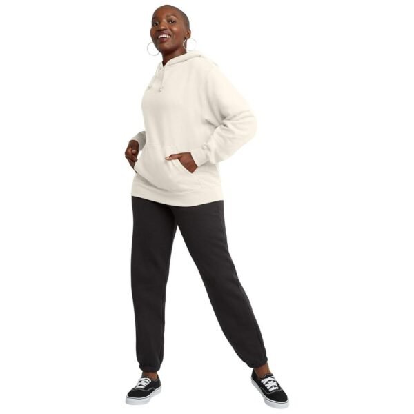 Model wearing a women's midweight fleece pullover hoodie, styled with casual jeans for an everyday look