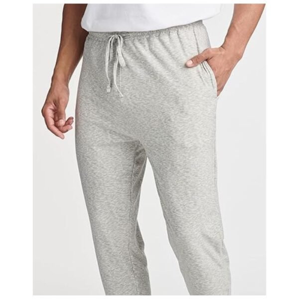 Model wearing Men's Pajama Joggers, showcasing the slim fit and cozy fabric in a casual setting