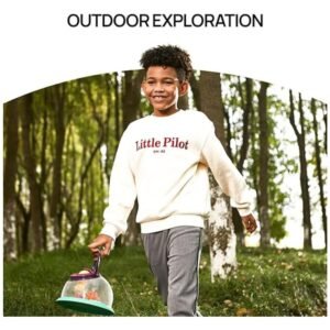 Young boy carrying the bug catcher kit for kids during an outdoor exploration adventure