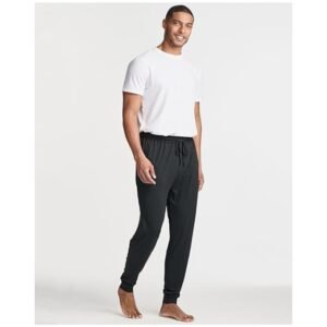 Model wearing Men's Pajama Joggers, showcasing the slim fit and cozy fabric in a casual setting