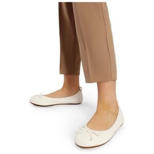 A model wearing the ballet flats, demonstrating their stylish and comfortable fit for various occasions