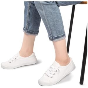 Model wearing women's slip-on canvas shoes, styled with casual outfits like jeans and a T-shirt, demonstrating comfort and versatility
