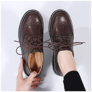 Woman wearing stylish lace-up shoes with a vintage feel, paired with casual outfit for everyday wear.