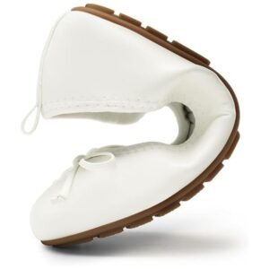The ballet flats folded and packed in a compact pouch, illustrating their portability and convenience for travel.