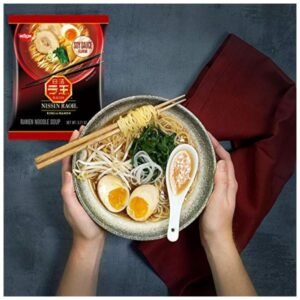 Steaming bowl of cooked Nissin RAOH Ramen Noodle Soup with tender noodles and rich broth