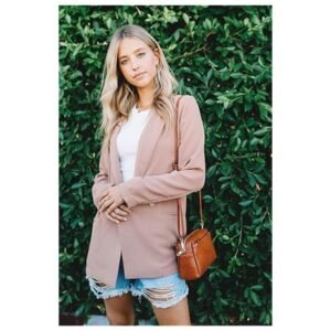 Model wearing the FashionPuzzle Triple Zip Small Crossbody Bag, demonstrating its stylish and comfortable fit as a crossbody bag.
