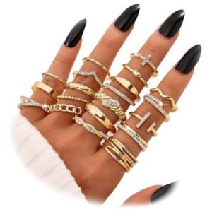 Flat lay of the gold knuckle rings set with various styles and sizes arranged neatly