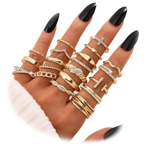 Flat lay of the gold knuckle rings set with various styles and sizes arranged neatly