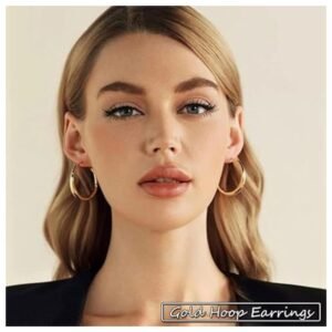 Woman wearing a pair of gold hoop earrings from the 36 pairs set, styled for a chic look