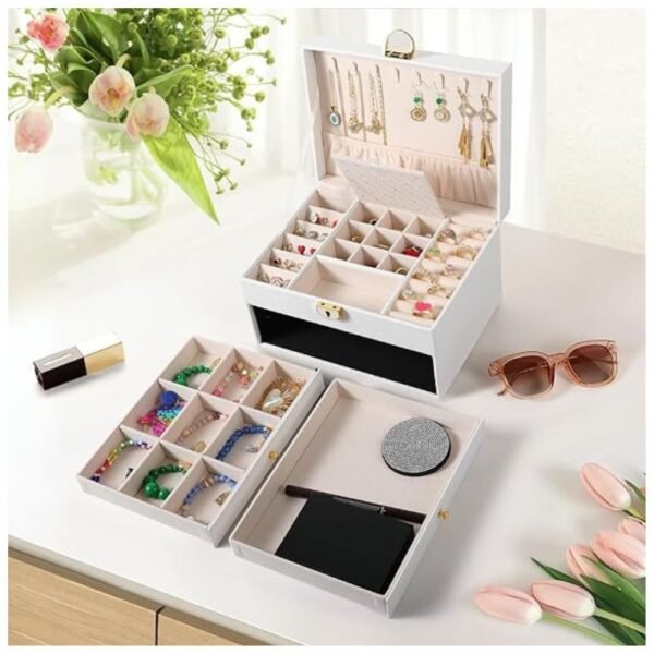 The 3-layer jewelry box placed on a table, showcasing its stylish design and functionality