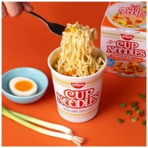 A bowl of Nissin Cup Noodles Soup, cooked and ready to enjoy with the savory chicken broth and noodles