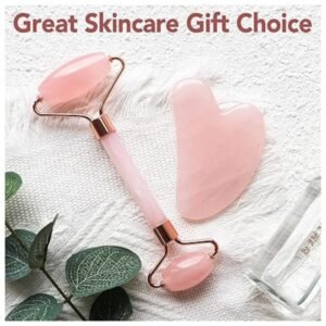 Flat lay of rose quartz skincare tools with elegant packaging, perfect for gifting
