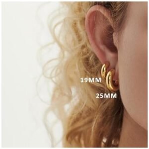 Multiple styles of chunky gold hoop earrings including thick and thin designs