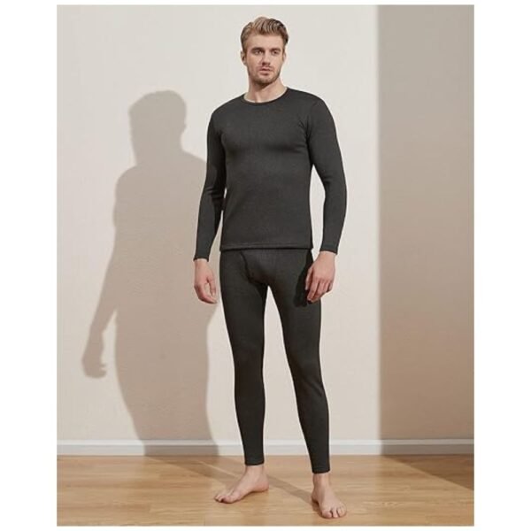 Model wearing men's thermal underwear set, showcasing the snug fit and comfort in a cold weather environment.