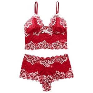 Flat lay of lace longline bralette and shortie set, displaying floral pattern, scallop edges, and soft lace fabric.