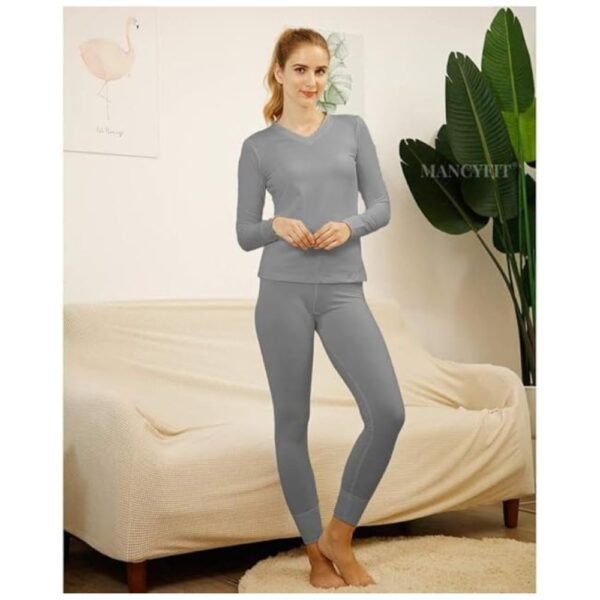 Model wearing thermal underwear set with fleece lining for warmth.