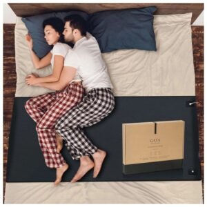 Grounding mat placed on bed for better sleep and relaxation