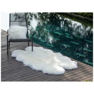 Luxurious Australian sheepskin rug placed on the floor, enhancing the room's decor