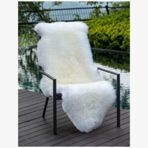 Australian sheepskin throw draped over a chair for added texture and warmth.