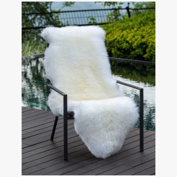 Australian sheepskin throw draped over a chair for added texture and warmth.